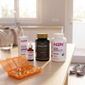 Pack Energía Diaria: Evolytes plus+, vitaminas D3+K2, Ultra omega-3 y el pastillero de regalo sobre la mesa del desayuno